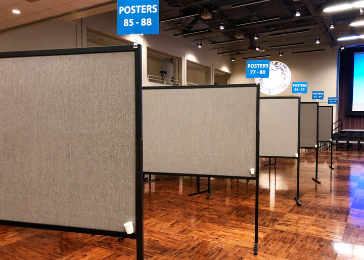 Four by six foot poster boards with signs clipped to top to mark sections at UC San Diego
